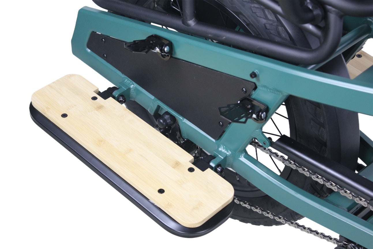 Close-up of a chainsaw with a wooden handle