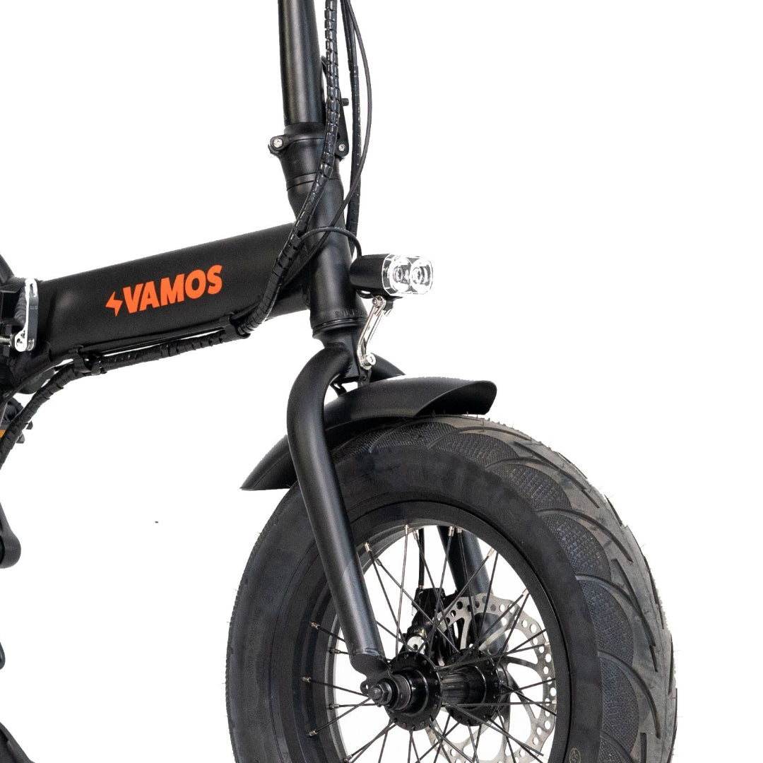 Integrated front and rear lights on Vamos bike image.