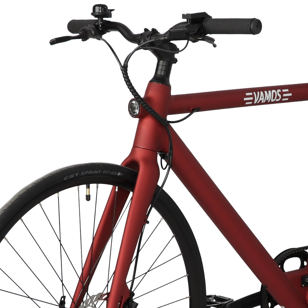 Integrated front and rear lights on Vamos bike image.