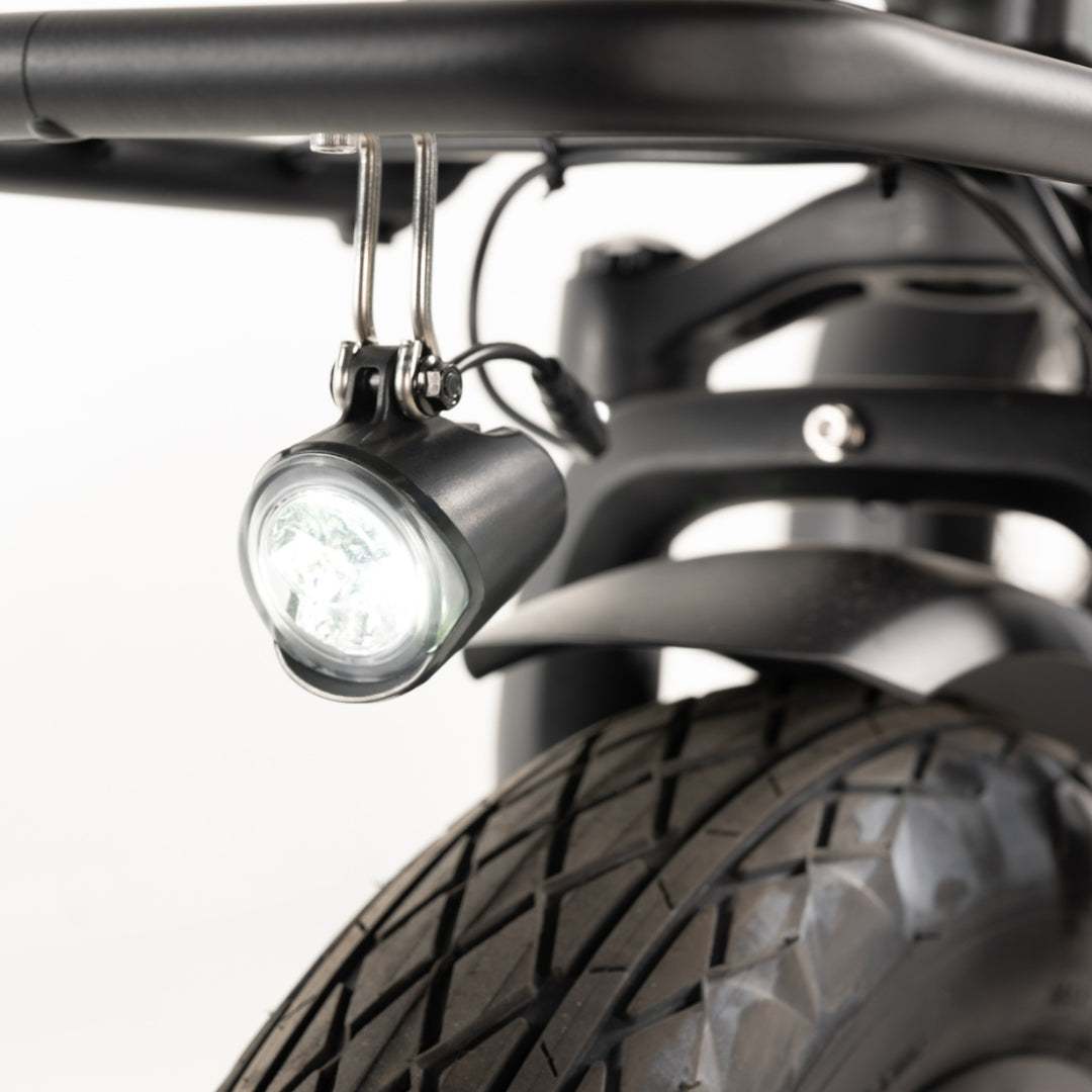 Integrated front and rear lights on Vamos bike image.